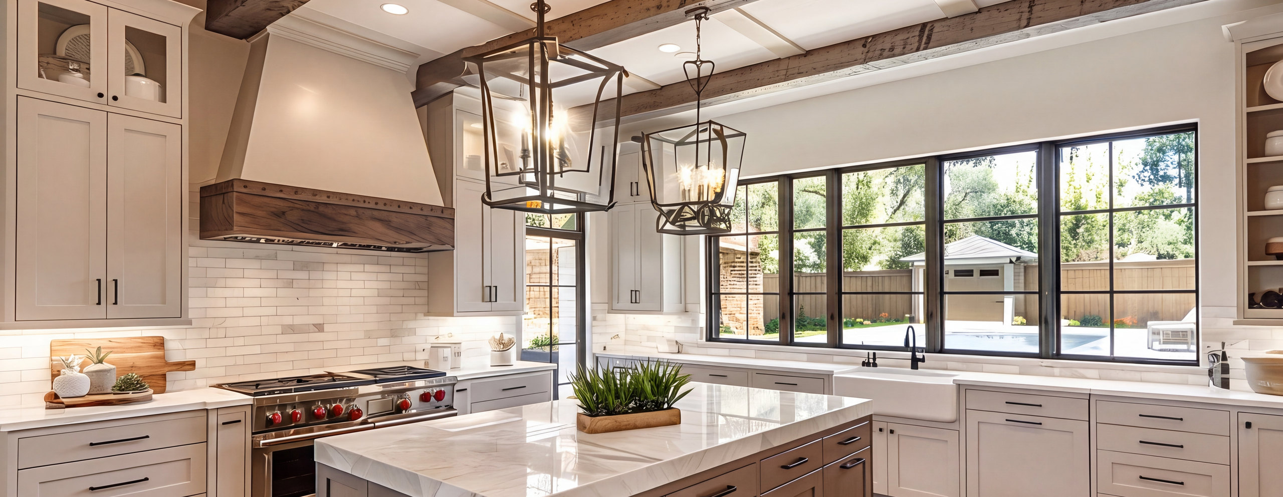 Renovated open kitchen with marble island and warm wood cabinetry